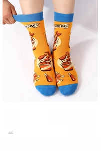 Detail showing elastic mid-calf socks with fried chicken pattern and Feed Me text