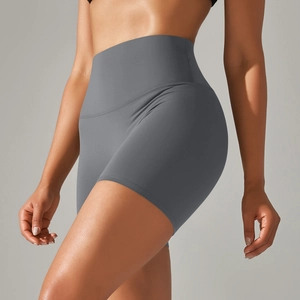 Detail view of charcoal gray high-waisted yoga shorts with elastic compression fabric