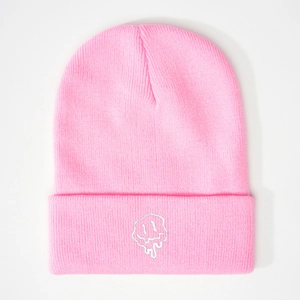 Pink knit beanie hat featuring an embroidered melting face design on a folded brim