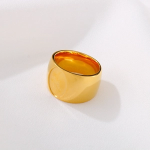 Polished gold stainless steel wide band ring with a flat oval top in minimalist style