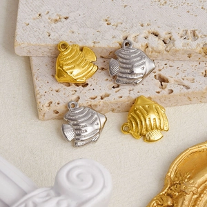 Detail of 304 stainless steel fish charms in gold and silver finish for DIY jewelry