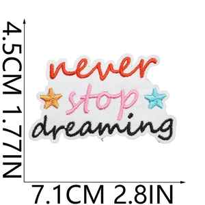 Detailed view of Never Stop Dreaming embroidered patch with size markers in cm and inches