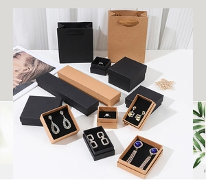 Collection of black and kraft paper jewelry boxes with matching gift bags for accessories