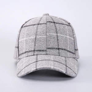 Close-up of thick houndstooth wool fabric texture on a vintage warm baseball cap