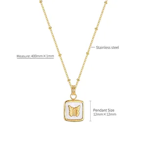 Collier vintage français en acier doré avec pendentif carré en nacre et papillon