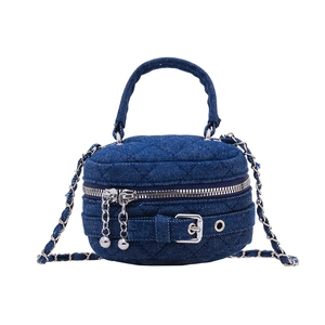 Quilted blue denim mini chain bag for kids featuring silver zipper and crossbody strap