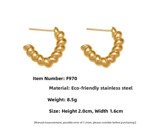 Detail view of 18k gold plated stainless steel croissant earrings with 2.0cm size measurement