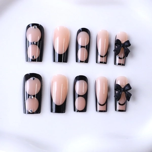 Gothic style black French long press-on nails with 3D bows and sparkling rhinestones