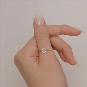 925 Sterling Silver Ring with heart-shaped AB colorful diamond on a hand model