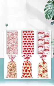 Transparent Valentine candy bags with heart patterns and ties for festive snack gifts