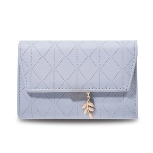 Close-up of light blue PU leather wallet featuring quilted diamond stitching and gold leaf charm