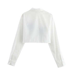 Back view of a white long-sleeved cropped shirt featuring coconut tree embroidery details