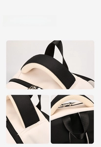 Detail of backpack top handle with breathable honeycomb mesh and reinforced stitching