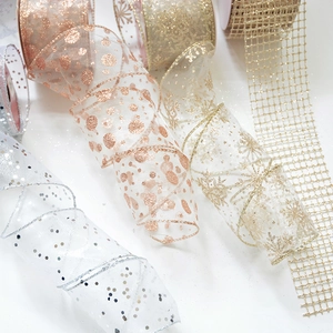 Sparkling Christmas ribbons with sequins, snowflakes and dots for gift decoration