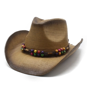 Detailed view of woven straw cowboy hat with colorful wooden beads on a brown band