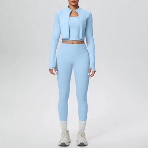 Three-piece light blue fitness set with zip-up jacket, sports bra, and high-waist yoga leggings