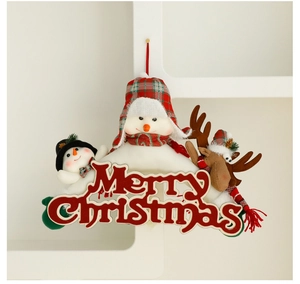 Detail of Christmas hanging decor with plush snowman and reindeer on Merry Christmas sign