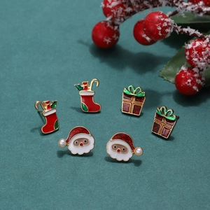 Christmas earring set with Santa Claus, stocking and gift box motifs in festive colors