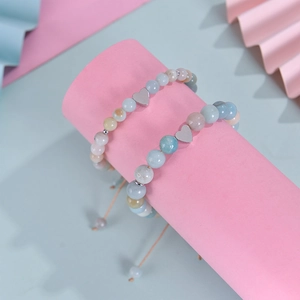 Detail of pink and blue zebra stone heart bracelets set for back to school gift