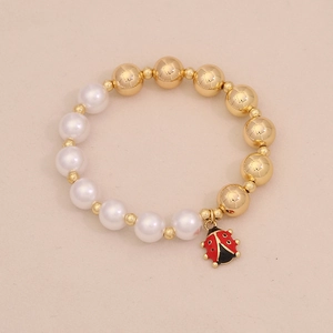 Fashionable faux pearl beaded bracelet featuring a gold beads and enamel ladybug charm