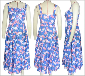 Detailed views of a blue floral sleeveless midi dress with side slit and drawstring chest