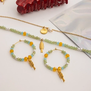 Detailed set of bohemian beaded necklaces and hoop earrings with gold fish pendants