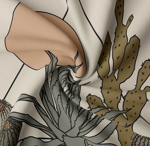 Detailed view of the woven fabric texture and desert cactus print on this wall tapestry