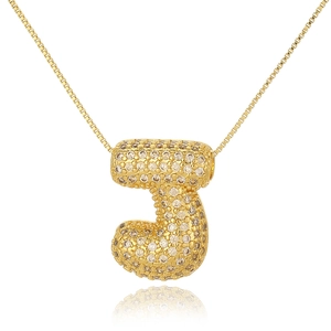 Macro shot of gold bubble letter J pendant necklace with iced-out cubic zirconia stones