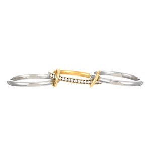 Close-up of interlocking tricolor metal rings featuring micro-pave sparkling crystals