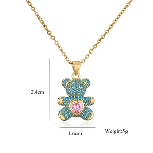 Fashionable gold bear necklace with blue zircon pave and pink heart stone pendant