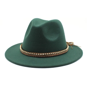 Detail of dark green wool fedora hat featuring a brown braided band with gold metal beads