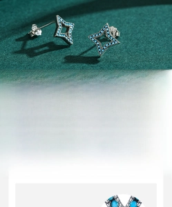Macro detail of S925 sterling silver star earrings with inlaid turquoise stones
