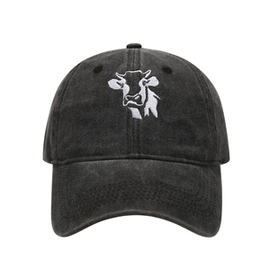 Close-up of high-quality cow embroidery on washed cotton vintage baseball cap texture