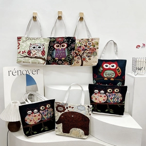 Ethnic canvas tote bags with owl and elephant embroidery in black and beige colors