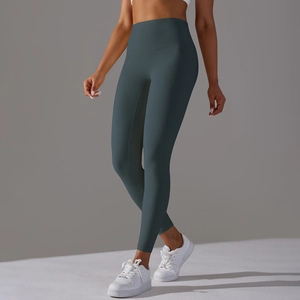 Detail view of high-waisted dark grey blue yoga leggings with seamless supportive fit