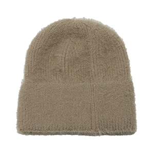 Close-up of soft faux mink fur texture on a warm beige knitted beanie hat