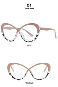 Close-up of infinity shaped oval glasses frame with pink and cow print pattern