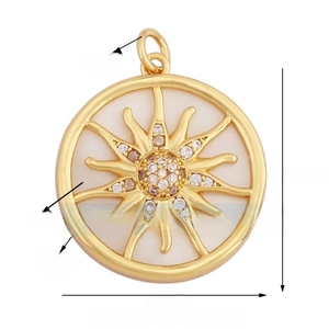 Detail of 22mm sun pendant with shell inlay and micro-pave crystals in golden finish