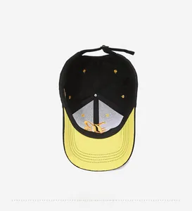 Detail view of baseball cap interior with yellow embroidery and adjustable metal buckle