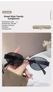 Detail des breiten schwarzen Bügels und des ovalen Rahmens dieser Retro-Sonnenbrille
