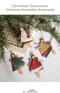 Detail of painted metal Christmas angel ornaments with colorful winter patterns