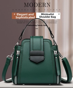 Detail of dark green bucket bag featuring V-shaped woven texture and metal lock closure