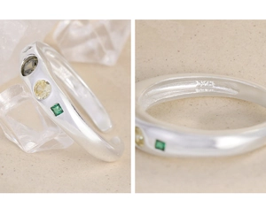 Macro shot of S925 silver ring featuring geometric micro-set yellow and green zircons