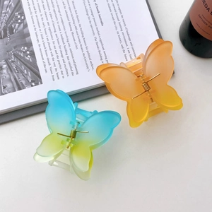 Elegant matte butterfly hair claw clips in gradient orange and blue green for women