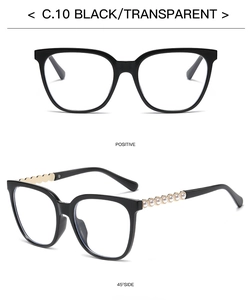 Macro detail of square black glasses frames with elegant white pearl trim on the temples
