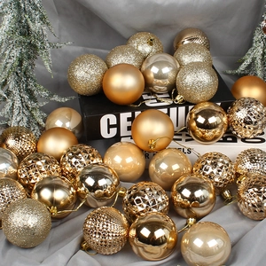 Champagne gold Christmas ornaments in matte, glossy, glitter, and carved geometric finishes