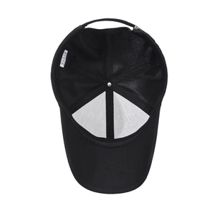 Interior view of black polyester baseball cap showing stitching and care label details
