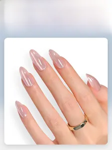 Detail of almond-shaped cat-eye press-on nails with a pearlescent nude pink finish