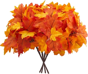 Close-up of artificial maple leaves with orange red gradient and realistic vein textures