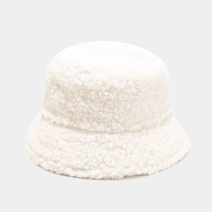 Detailed view of soft white lamb wool fabric texture on a minimalist bucket hat